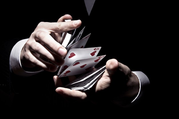 magician shuffling cards cool way spotlight 181624 26713